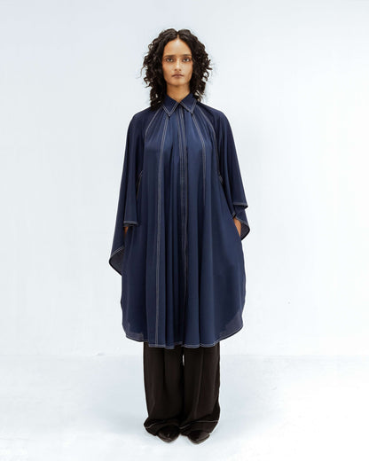 The Leh Studios Selene Crepe Set, part of the Rhythm of time collection, is worn by a model. This elegant designer wear features a navy blue crepe tunic and black trousers, both accented with unique white stitching, highlighting eco-friendly design and ethical fashion from Leh clothing.