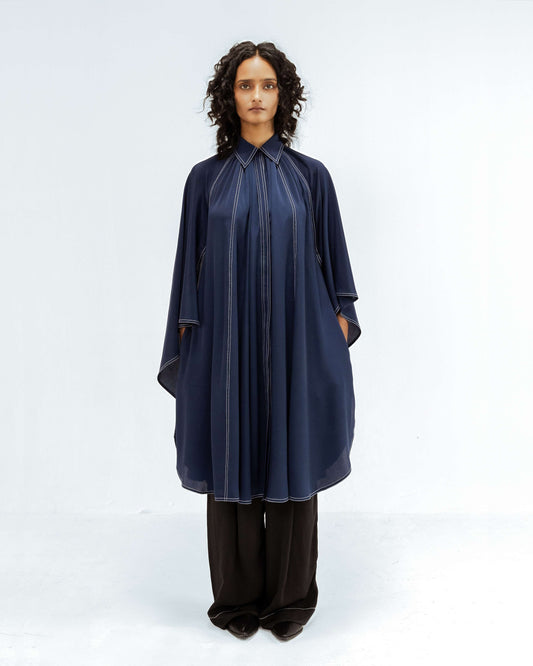 The Leh Studios Selene Crepe Set, part of the Rhythm of time collection, is worn by a model. This elegant designer wear features a navy blue crepe tunic and black trousers, both accented with unique white stitching, highlighting eco-friendly design and ethical fashion from Leh clothing.